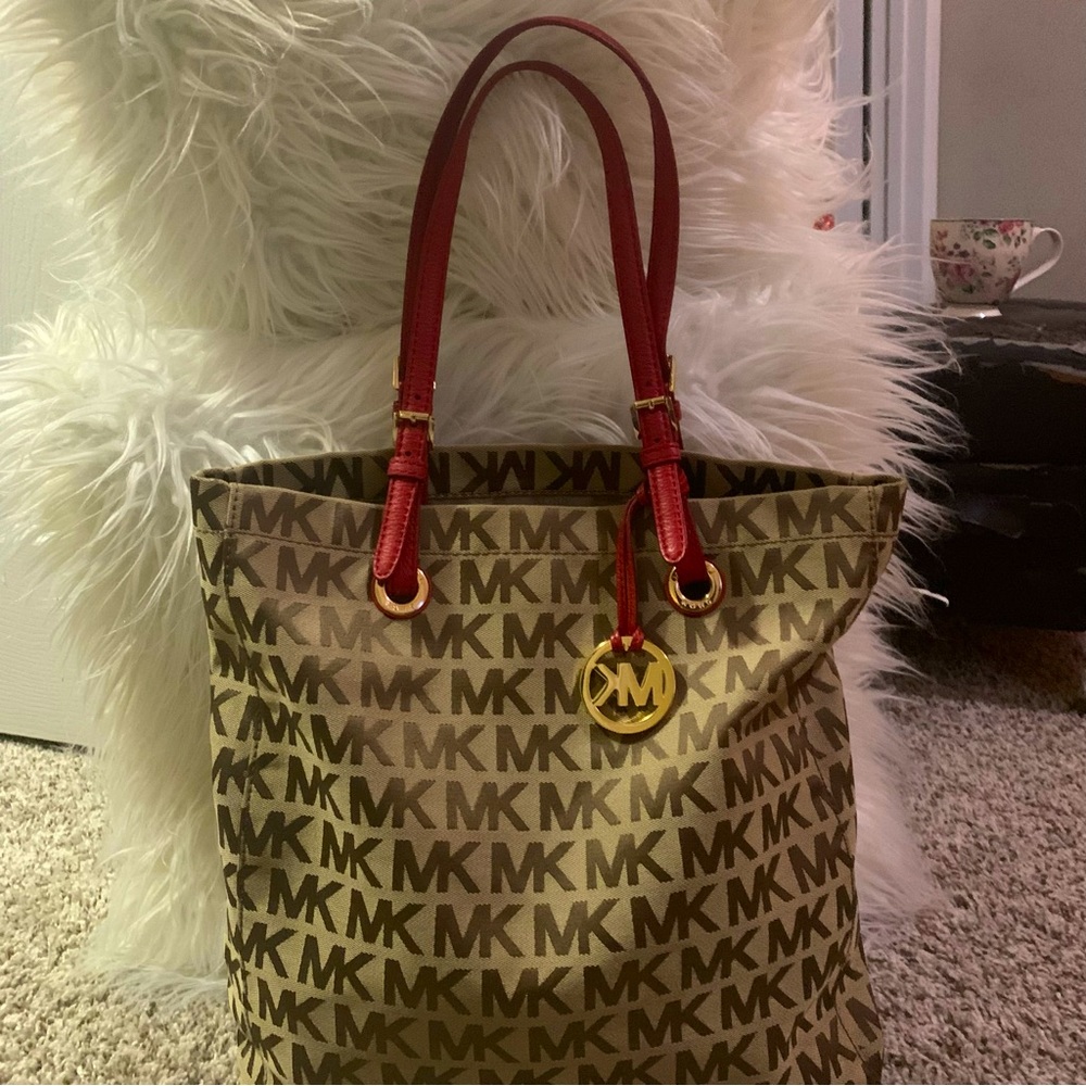 Michael Kors Collection Tote Tan brown with red leather straps.
